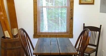 Solar powered cottage at lake, with dock, on private 300 acre timber preserve