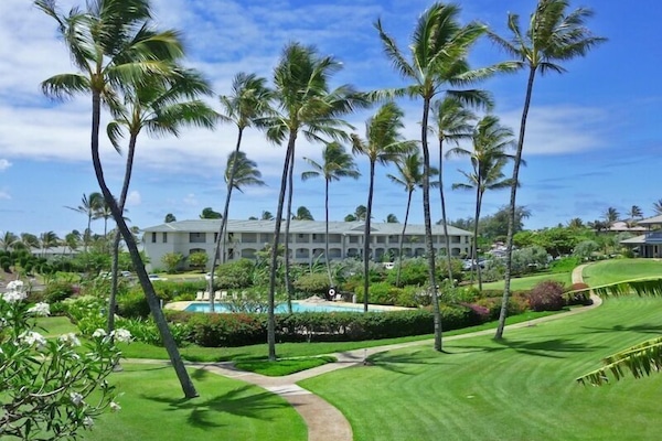 Lanai view with pool in front, and beach a short walk to the left