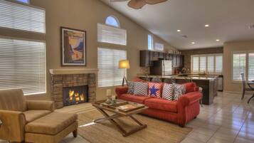 Älytelevisio, takka, DVD-soitin, kirjoja