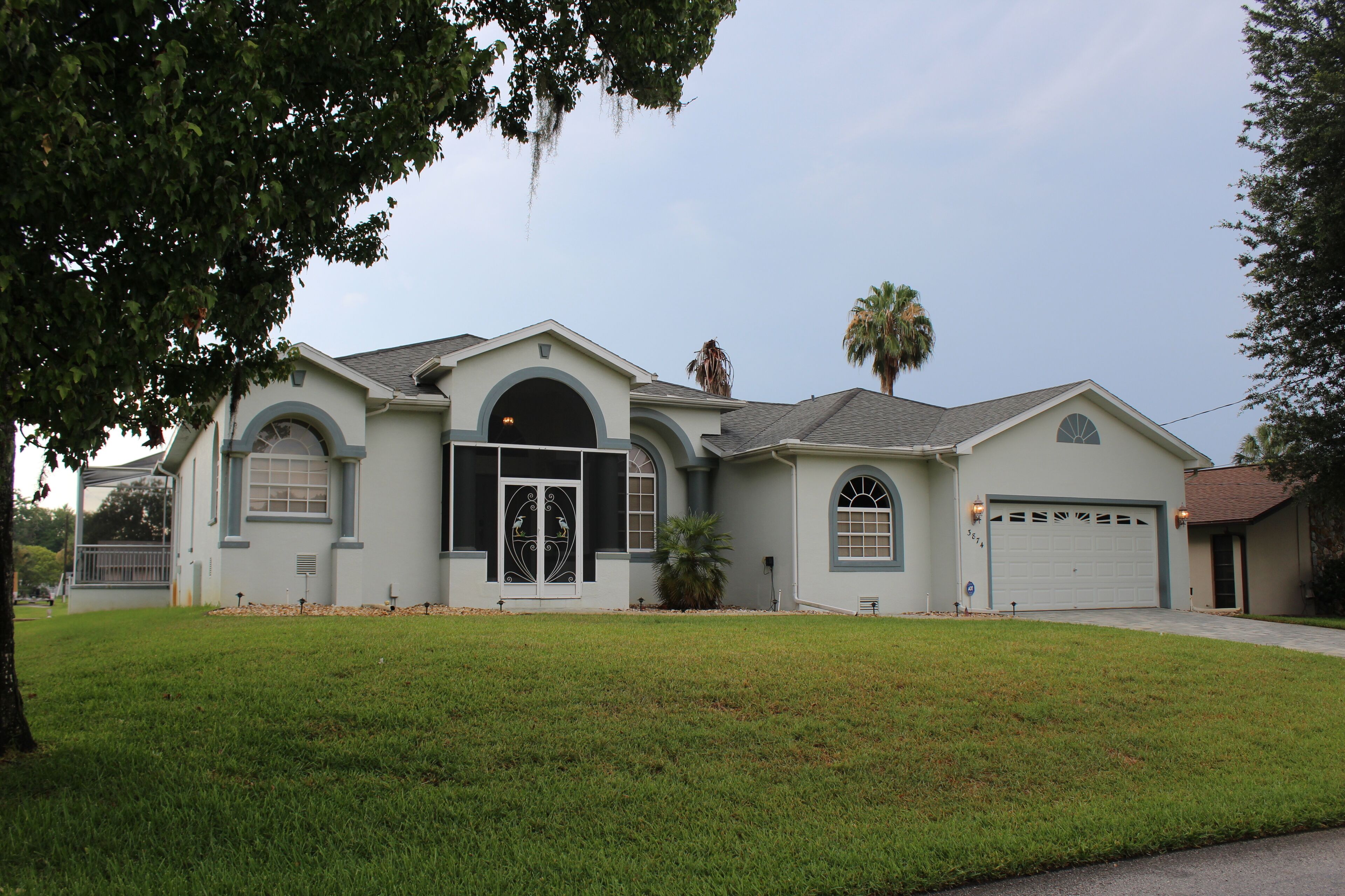 PRISTINE WATERFRONT HOME WITH DESIGNER FINISHES & HEATED SWIMMING POOL