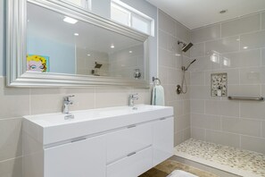 Combined shower/tub, hair dryer, towels, soap