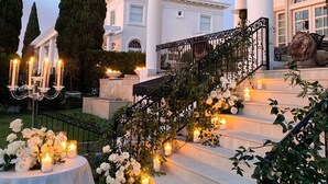 A grand staircase with white columns and a pergola, leading to a building with a classical facade. - Romantic Guest House, Spectacular Views, Close to everything , Private Hot Tub (San Diego)