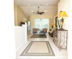 Relax in this inviting living area with a sofa, armchairs, and coffee table.