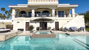A large, two-story house with a swimming pool in front. - Luxury Estate in Prime Location w Panoramic views of Lake Havasu (Lake Havasu City)