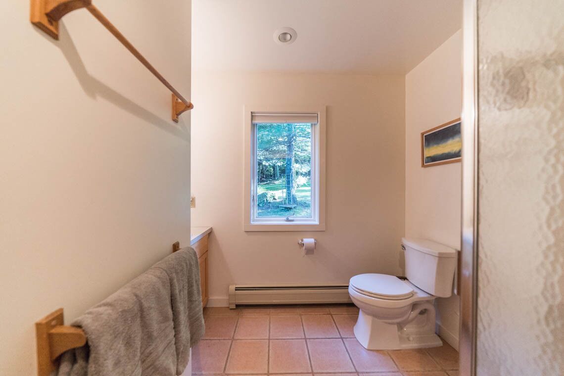 Downstairs bathroom with shower.