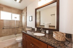 Combined shower/bathtub, hair dryer, towels, toilet paper
