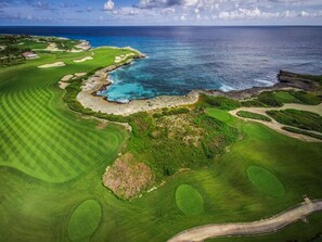 Enjoy a round of golf with ocean views on this well-manicured course featuring manicured fairways, greens, and sand bunkers.