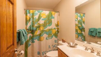 Combined shower/tub, hair dryer, towels, soap