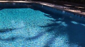 A clear swimming pool with a tiled edge and a metal handrail. - Beautiful Lahaina Side 2 BR Condo with Beach View B7 (Honokowai)