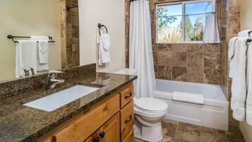 Combined shower/tub, hair dryer, towels, soap