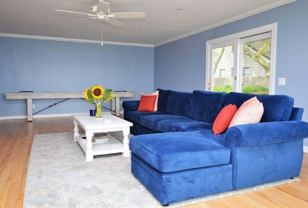Large Family Room with shuffleboard table, sliding doors to side deck