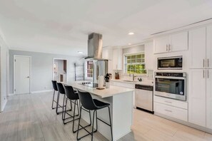Coffee/tea maker, fridge, microwave, oven