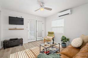 Flat-screen TV, DVD player, books