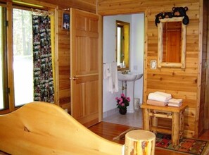 Combined shower/bathtub, towels, toilet paper