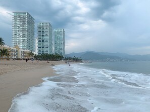 On the beach, sun loungers, beach towels