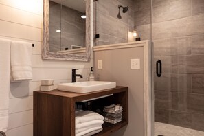 Combined shower/tub, hair dryer, towels, soap