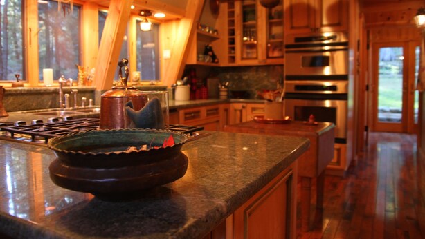 A kitchen with wooden cabinets, a granite countertop, and stainless steel appliances. - Cabin & Spa - Luxurious & Private 2 blocks from the lake and conservancy  (Tahoe City)