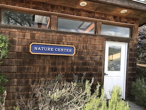 Nature Center with a rustic exterior and lush surroundings.