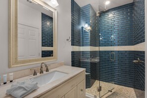 Combined shower/tub, hair dryer, towels, toilet paper