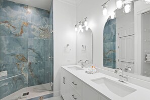 Combined shower/tub, hair dryer, towels, soap