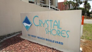A sign for Crystal Shores at 921 West Beach Boulevard. - Crystal Shores, Gulf Shores. Family Friendly Beachfront Condo w/ Pool,GYM & more (Gulf Shores)