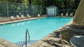 A swimming pool with lounge chairs and a covered changing room. - GREAT LOCATION!  Million dollar view of the Salt Pond  (Bethany Beach)