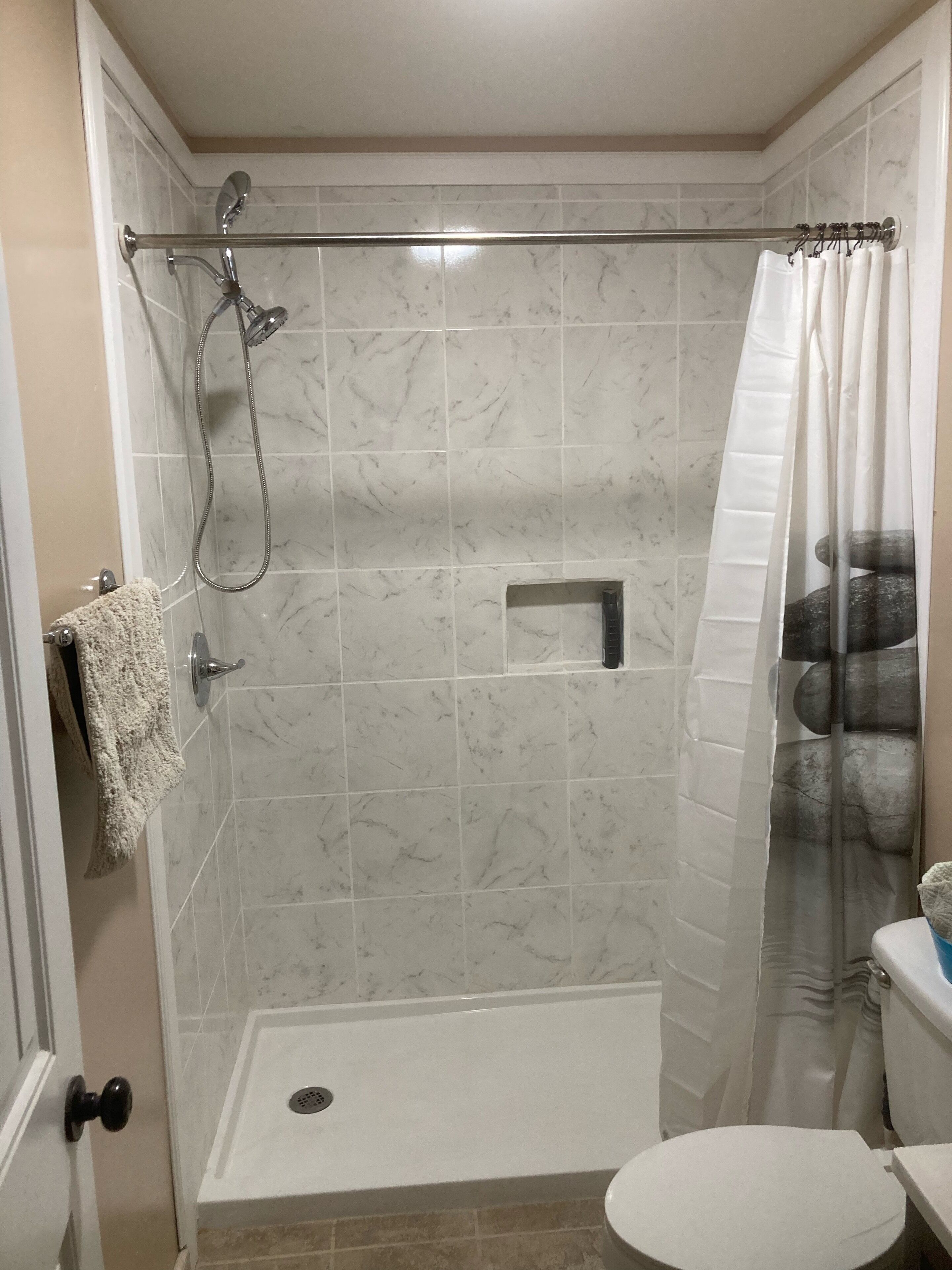 Shower, hair dryer, towels, toilet paper