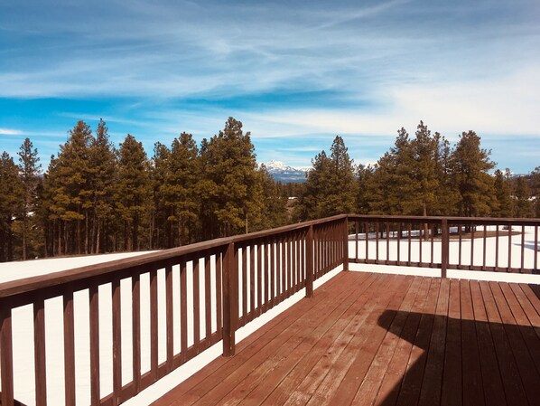 Enjoy breathtaking views of the surrounding mountains from this deck.