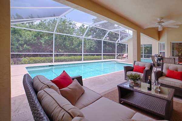 Relax and enjoy the outdoors beside the heated pool! Very private setting.