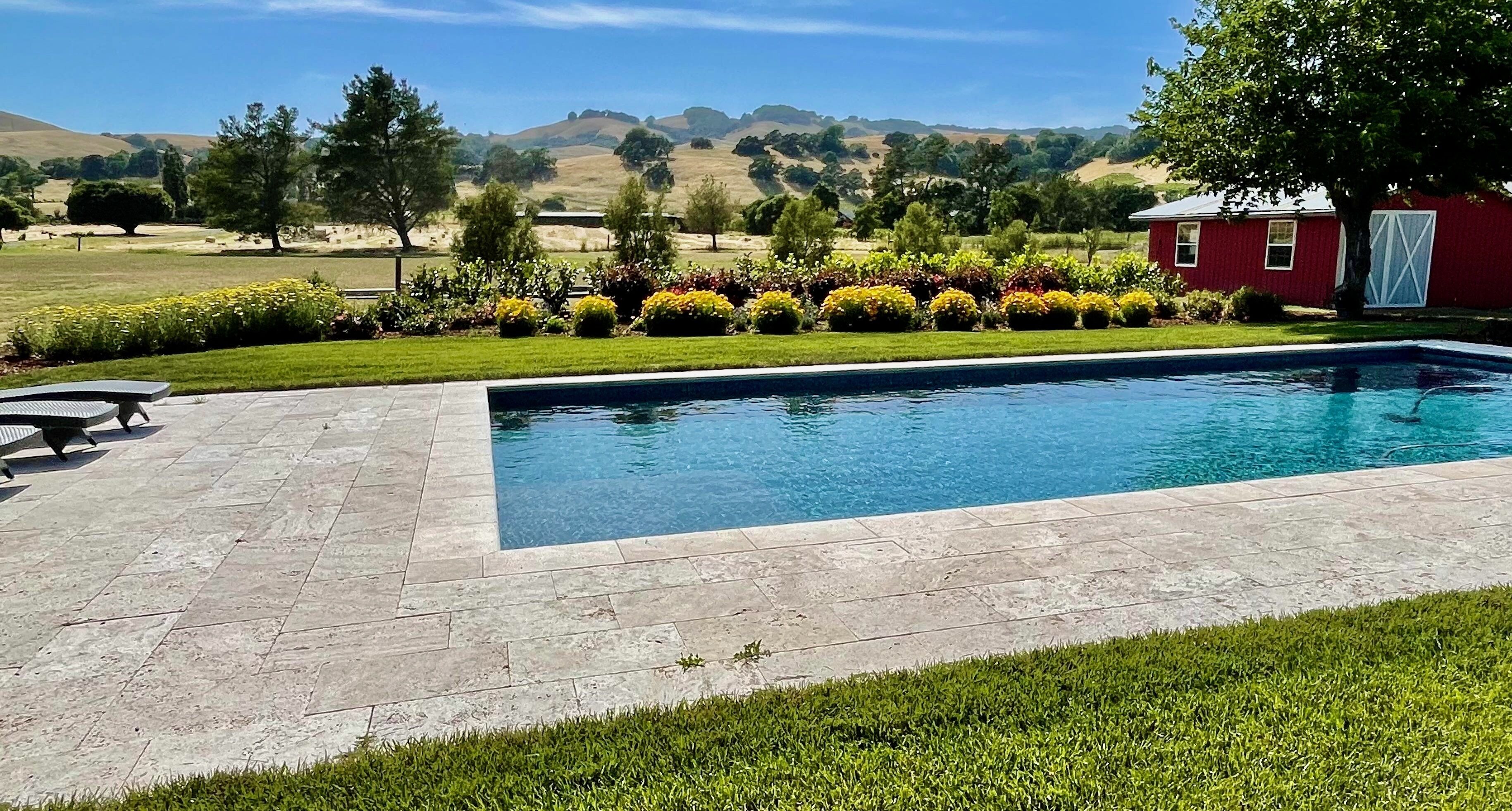 The  hill views from the expansive 20'x40' pool deck takes all your stress away