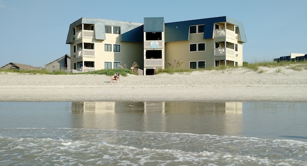 A multi-story hotel with balconies and a beach view. - A Place at the Beach IV #108 - First floor! Just steps to beach! Shore Drive! (Myrtle Beach)