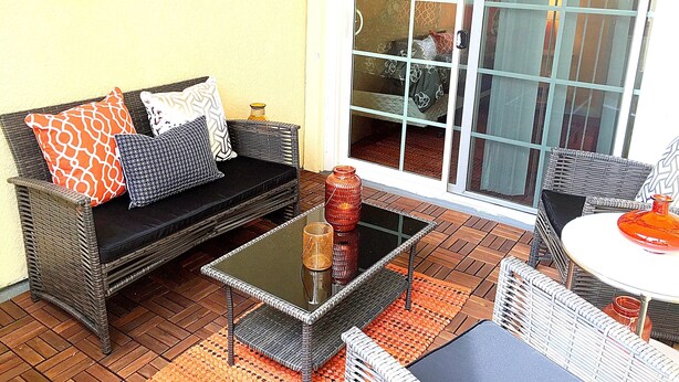 A furnished outdoor seating area with a sofa, chairs, and a table. - Steps to the water on both sides!! Mango Tango (San Diego)