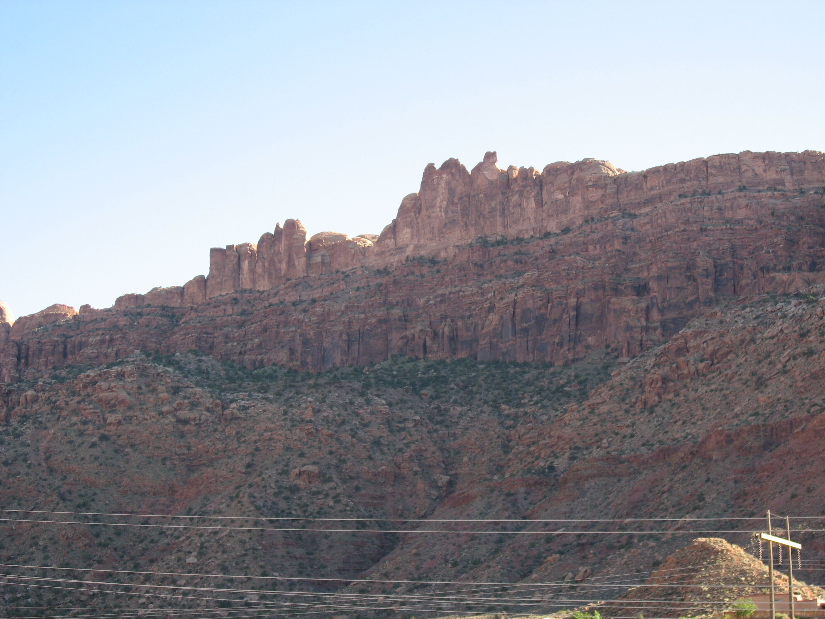 A mountainous landscape with rocky terrain and sparse vegetation.