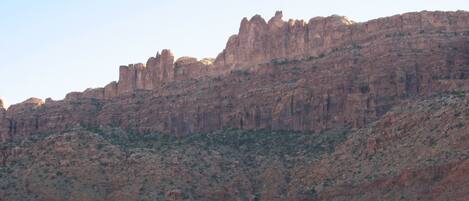 A mountainous landscape with rocky terrain and sparse vegetation.