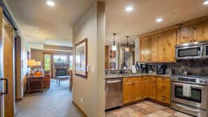 A spacious kitchen with wooden cabinets, stainless steel appliances, and a tiled floor. - Family Friendly w/ Suncadia Pool Access (Cle Elum)
