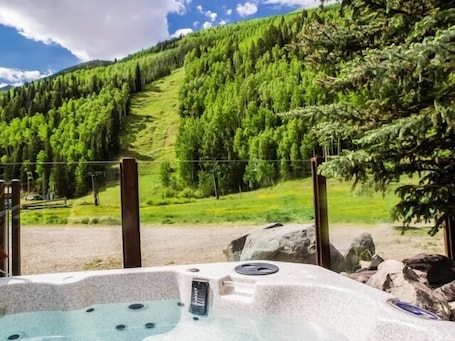 Outdoor spa tub. ABSOLUTE SKI-IN/OUT IN TOWN! GREAT VIEWS! HOT TUB! PRIVATE GARAGE! 2 BED + LOFT!