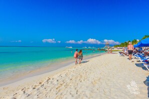 On the beach, sun loungers, beach towels