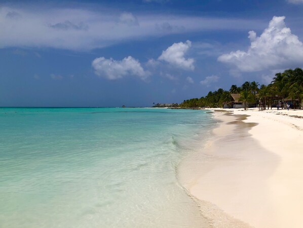 On the beach, sun loungers, beach towels