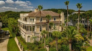 A large, two-story house with a balcony and a garden. - Villa Del Mare PRIVATE POOL/HOT TUB, OCEAN VIEWS, ELEV! (Isle Of Palms)