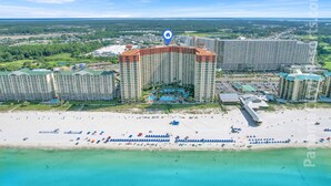 A large hotel complex with multiple high-rise buildings, a beachfront, and a clear view of the surrounding landscape. - Less Crowds More Paradise! Enjoy Sea View at the Shores of Panama  2 br, 2 bath (Panama City Beach)