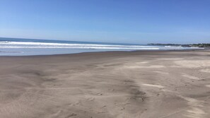 On the beach, sun-loungers