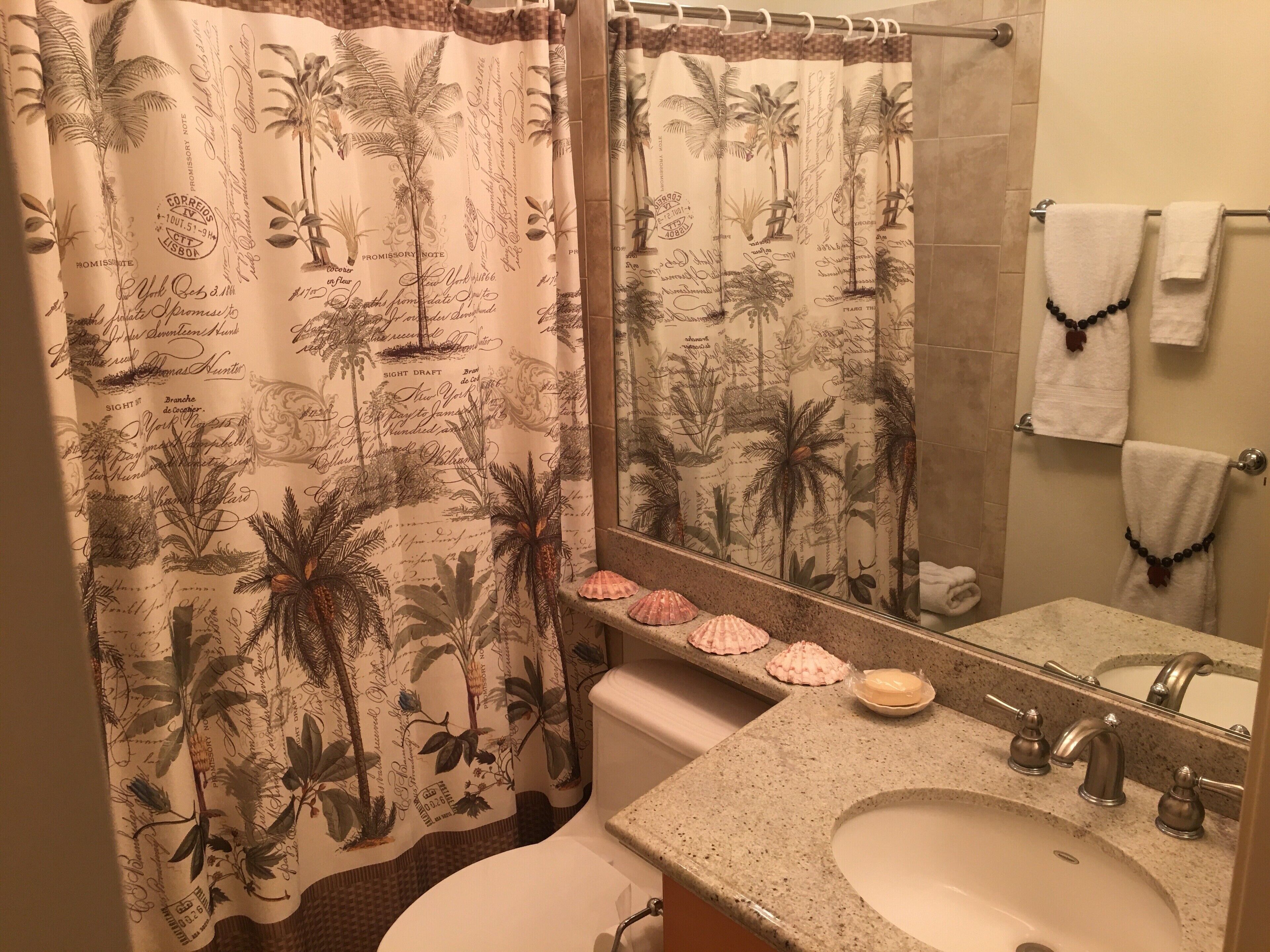 Combined shower/tub, hair dryer, towels, soap