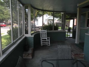 Relax on the covered porch with a comfortable rocking chair and enjoy the view of the surrounding neighborhood.