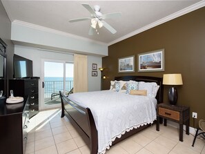 Relax in this serene retreat with a large bed, flat-screen TV, and ocean views from the balcony.