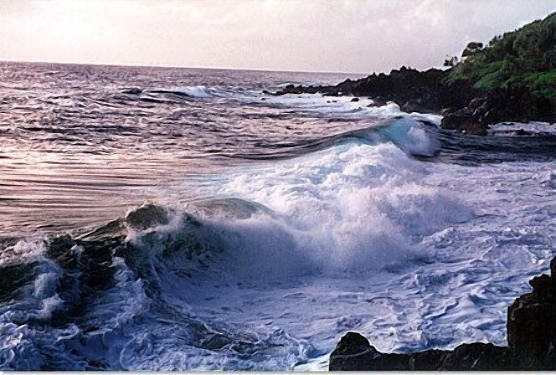 A coastal scene with waves crashing against rocks.