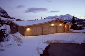 Front of house. 2 car garage w/auto-openers, stocked wood room.