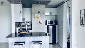 Fridge, microwave, stovetop, coffee/tea maker