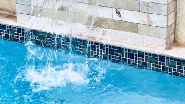 A stone wall with a water feature. - Convenient Location in Condado! (Santurce)