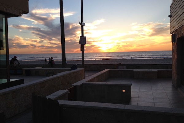 Beautiful views of sunsets, sand and surf from spacious deck