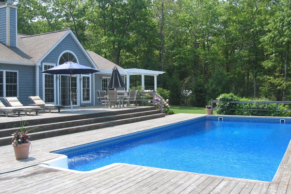 Oversized heated pool with large deck, hot tub and outdoor shower